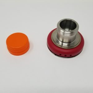 An orange bottle cap and a chuck