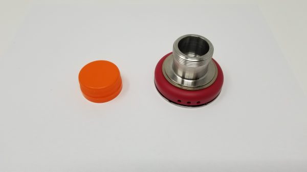 An orange bottle cap and a chuck