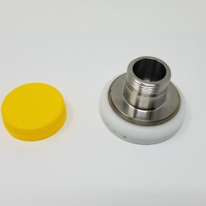 A yellow bottle cap and a chuck