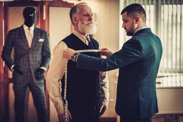 Tailor Measuring a Customer Tailor Measuring a Customer